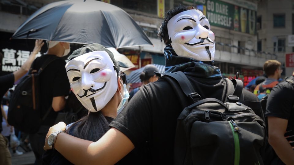 Protesters wearing V for Vendetta masks in Causeway Bay ahead of an unauthorized rally on National Day. Photo by Samantha Mei Topp.