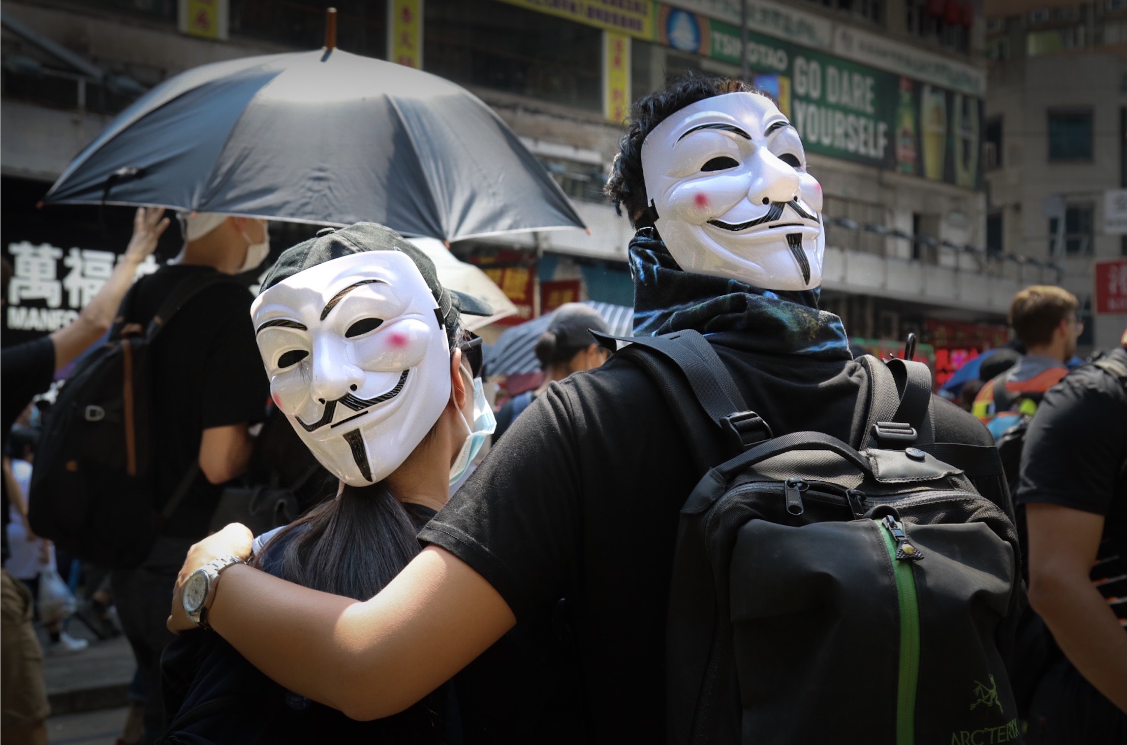Protesters wearing V for Vendetta masks in Causeway Bay ahead of an unauthorized rally on National Day. Photo by Samantha Mei Topp.
