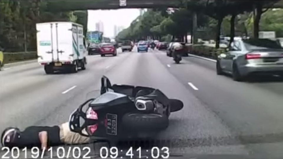 Screenshot taken from All Singapore Stuff’s video showing the motorcyclist on the ground after the accident. All Singapore Stuff/Facebook