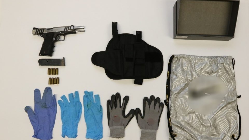 Pistol, ammunition and other items seized from a home in Jurong West. Apparent Nike logo blurred out by our conscientious authorities. Photo: Central Narcotics Bureau/Singapore Police Force