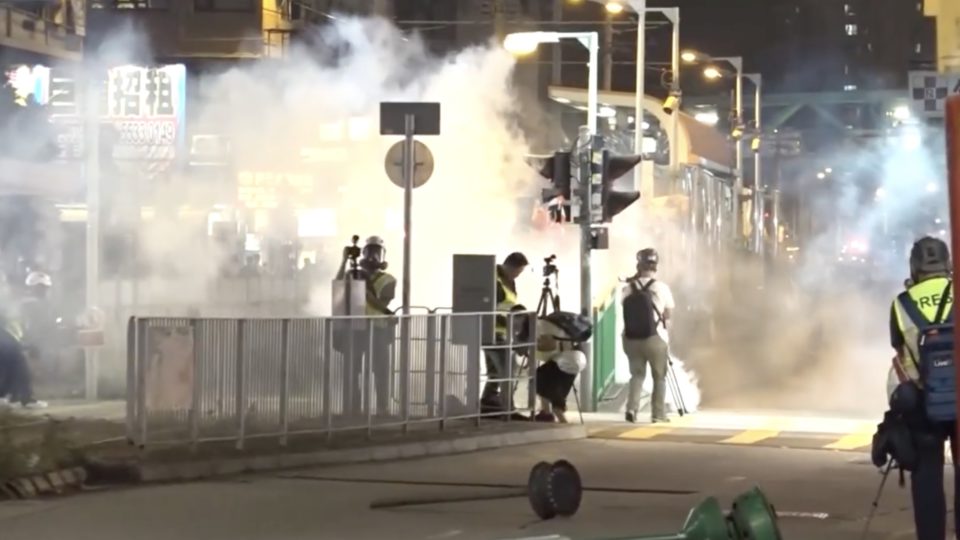 Frontline journalists get caught up in tear gas at a protest marking the third anniversary of the July 21 incident. Screengrab via Facebook/RTHK.