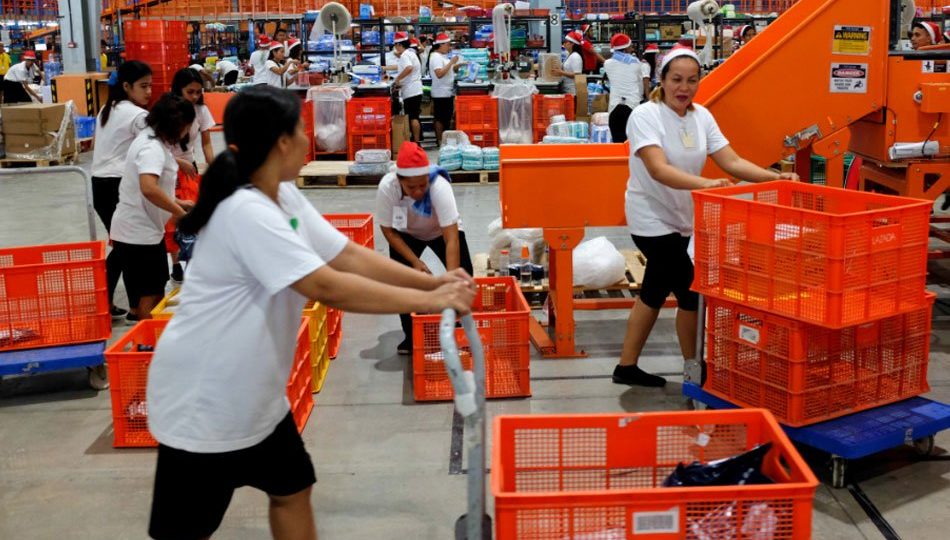 Workers inside Lazada’s warehouse in Cabuyao, Laguna. <i>Photo: George Calvelo/ABS-CBN News</i>