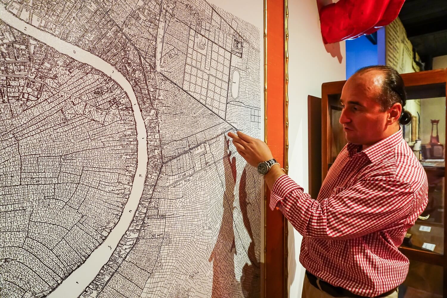 Museum founder Michael Messner points to Patpong’s location on a map from the late 1880s, back when it was only a rice field and banana plantation.