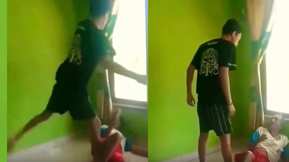 In the 30-second video, the 22-year-old small-time Youtuber Iyus Sinting was seen kicking and hitting his grandfather, 65-year-old Wasidi, while the latter was on the floor and pleading for mercy. Screenshot from Youtube