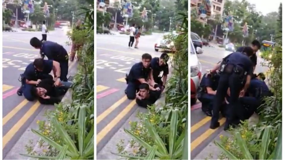 Police officers pin down Singaporean actor-singer Aliff Aziz Sunday morning on Orchard Road. Photos: Oh Media/Facebook