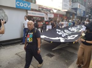 Tsang Kin-shing aka 'The Bull' leads a rally of people hours after it emerged that a student had died after falling from a car park. Photo by Vicky Wong.