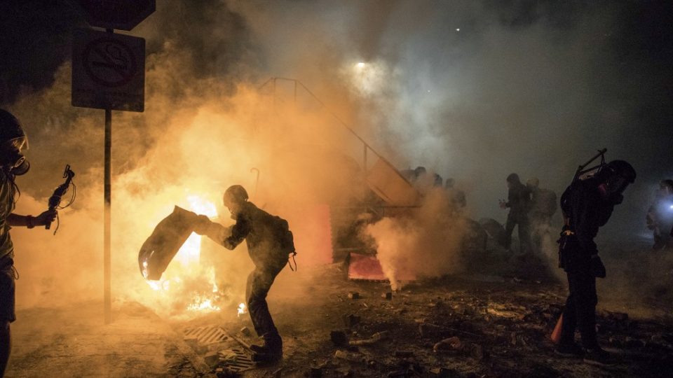 A barricade burns during clashes between protesters and police at the Chinese University of Hong Kong on November 12, 2019. Photo via AFP.