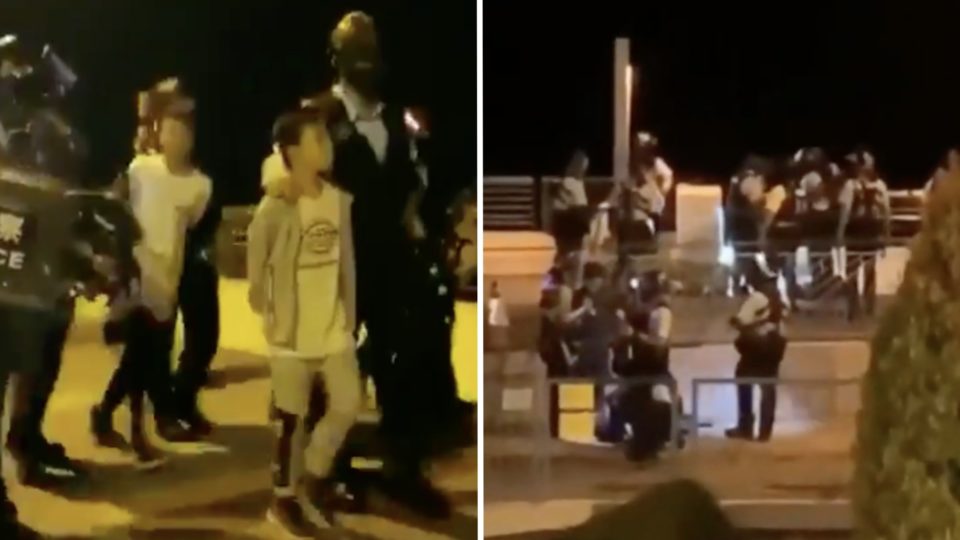 Police were filmed arresting a group of teens at Ma On Shan promenade.  Screengrabs via YouTube.