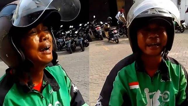 A motorcycle taxi driver crying after a customer cancelled his order. Photo: Video screengrab