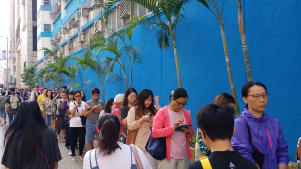 A like of voters waiting to cast ballots in today’s local elections snakes down the street in Tai Kok Tsui. Photo by Vicky Wong.