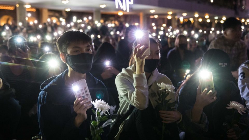 People attend a vigil in Hong Kong on November 10, 2019, in memory of university student Alex Chow, 22, who succumbed to head injuries sustained during a fall as police skirmished with demonstrators last weekend. Photo via AFP.