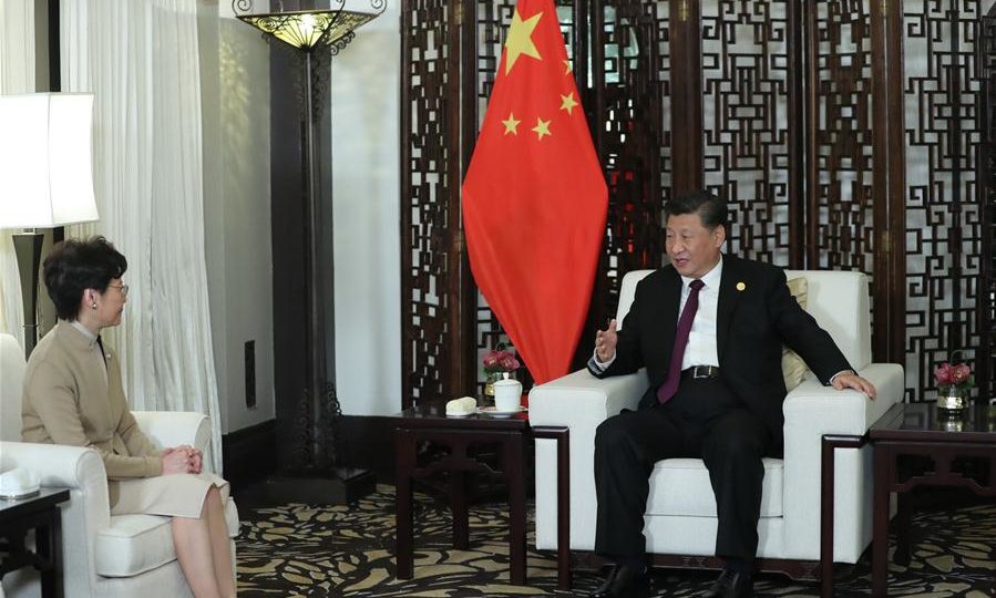 Chinese President Xi Jinping meets with Hong Kong Chief Executive Carrie Lam on the sidelines of a trade event in Shanghai yesterday. Photo via Xinhua.