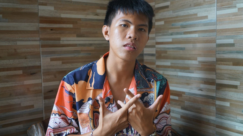 Thanayuth ‘Book’ Na Ayutthaya, aka ElevenFinger for his extra digit, raps about Khlong Toei and social justice. Photo: Coconuts