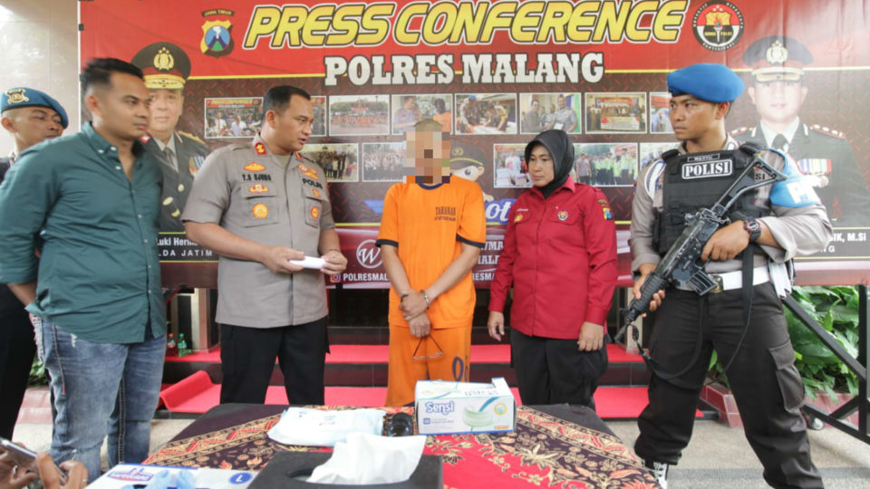 Suspected child molester CH (Center) shown to the media at a press conference on Saturday, Dec 7, 2019. Photo: Malang Regency Police