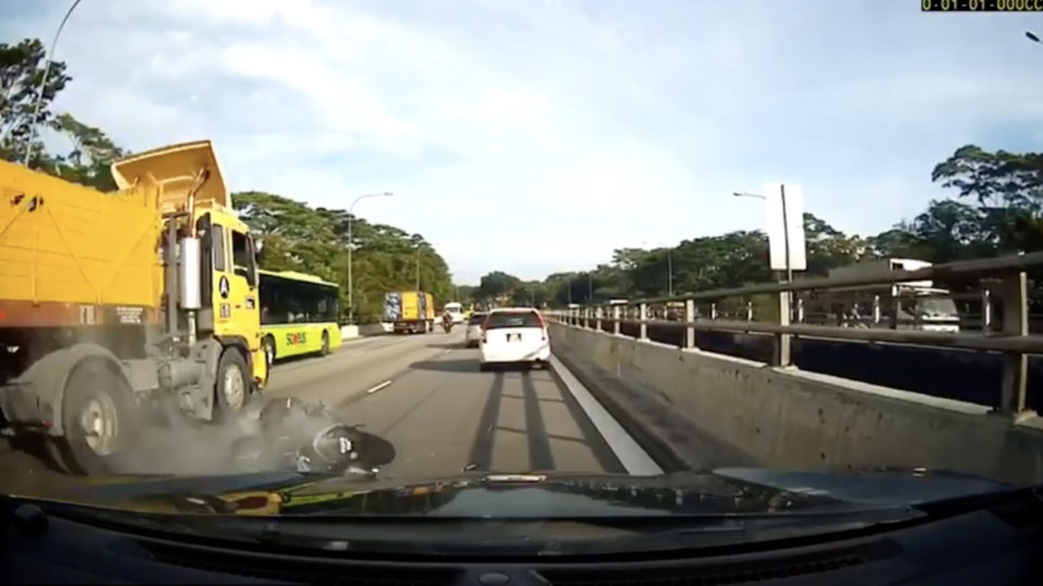 A motorcycle without its rider in a grisly accident Monday on the Seletar Expressway. Photo: Roads.SG/YouTube