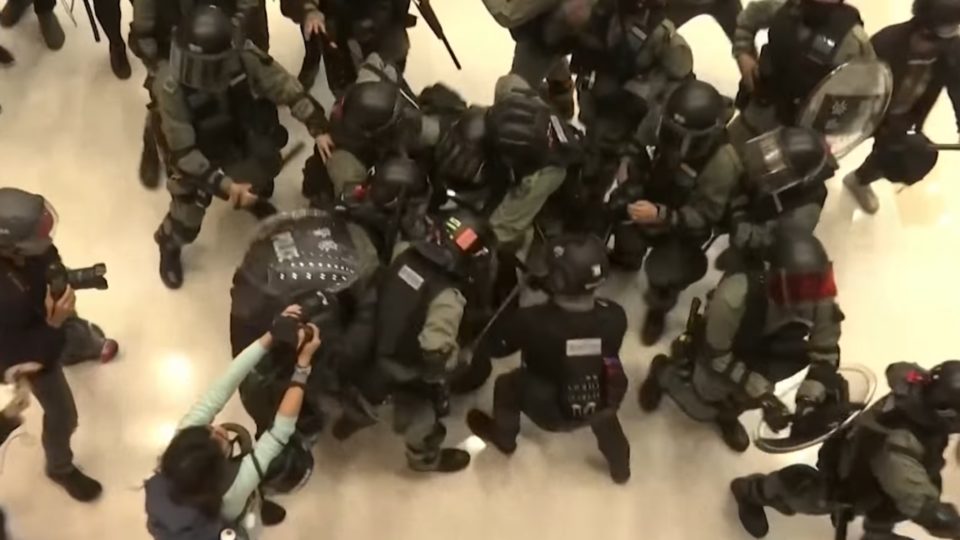 Riot police make an arrest during a scrum at the New Town Plaza shopping mall in Sha Tin on Dec. 15, 2019. Screengrab via YouTube.