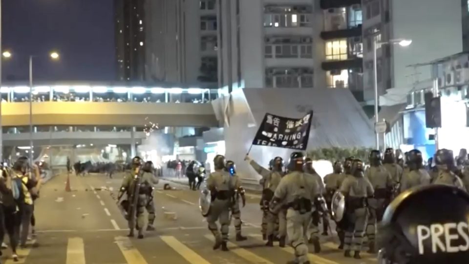 Riot police use tear gas to disperse protesters in Whampoa. Screengrab via Facebook/RTHK video.