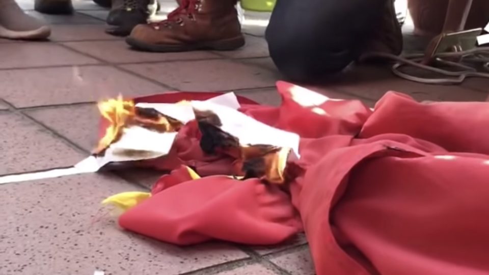 The moment protesters set the Chinese national flag on fire on September 21, 2019. Screengrab via YouTube.