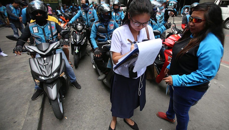 Student signs up for free Angkas ride in Oct 2019 after LRT2 suspended operations because of fire damage. <i>Photo: ABS-CBN News</i>