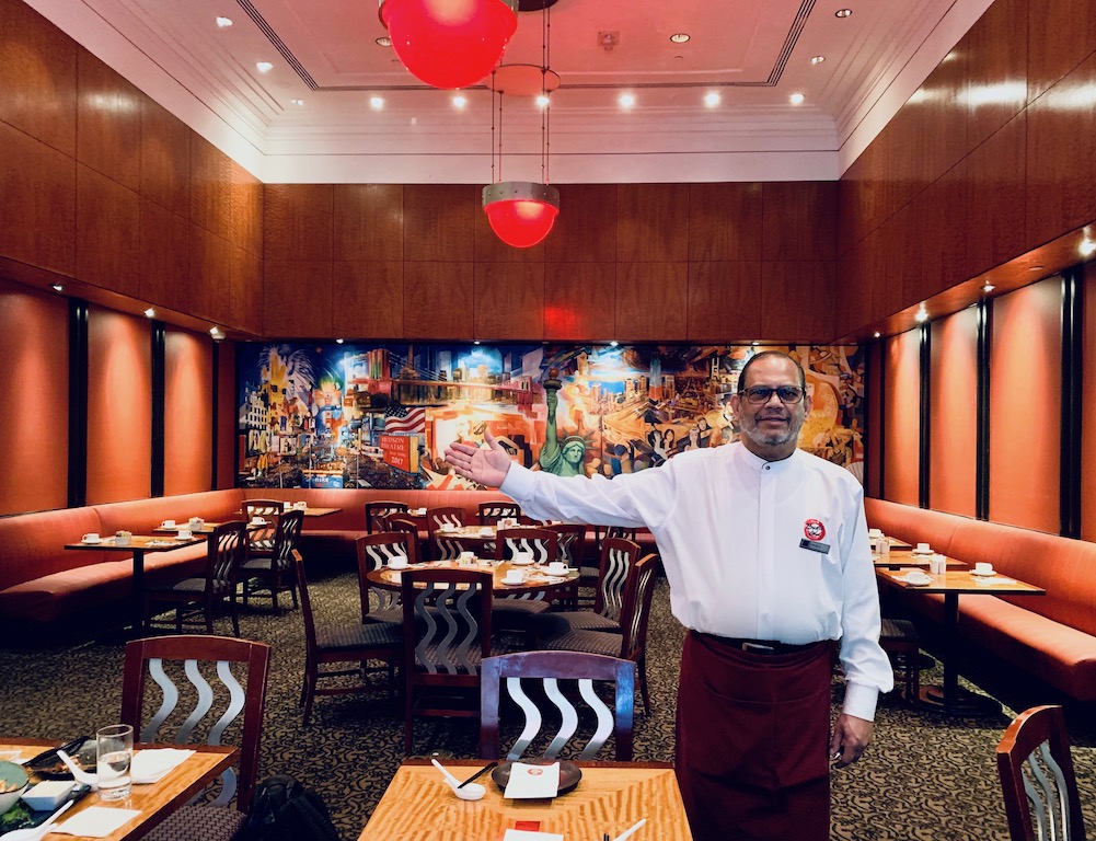 Siraj, our friendly and attentive waiter, has been working at the Millennium Hotel in Times Square for 19 years. Photo: Juliette Yu-Ming Lizeray