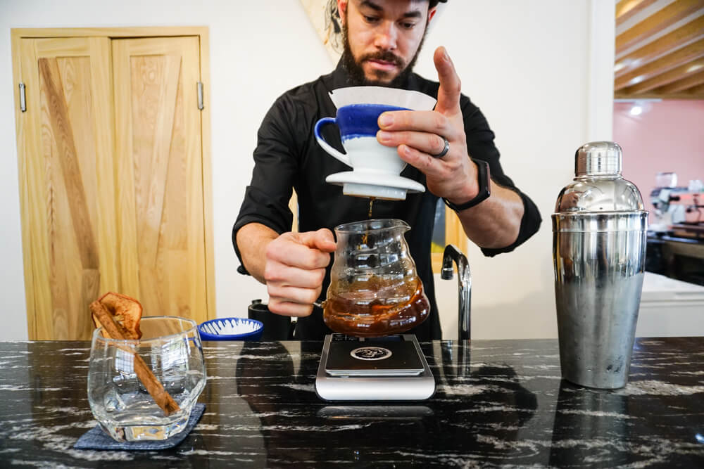 Gary is dripping coffee for customers. Photo: Coconuts Bangkok