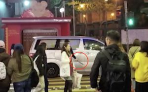 One of the assailants armed with a knife was seen getting into a getaway car on Dundas Street. Screengrab via Apple Daily video.