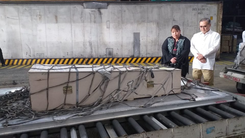 Family of Jeanelyn Villavende and Foreign Affairs Secretary Teodoro Locsin receive Villavende’s body in the Philippines on Wednesday <i>Photo: Department of Foreign Affairs</i>