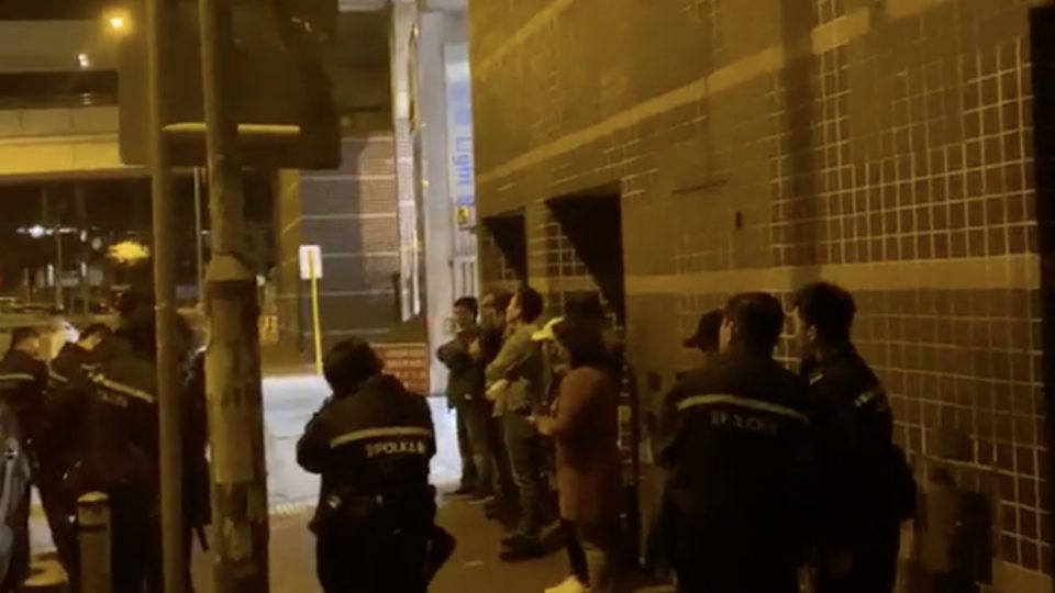 Police were filmed apprehending eight people outside a Lennon Wall in Tuen Mun. Screengrab via Facebook video.
