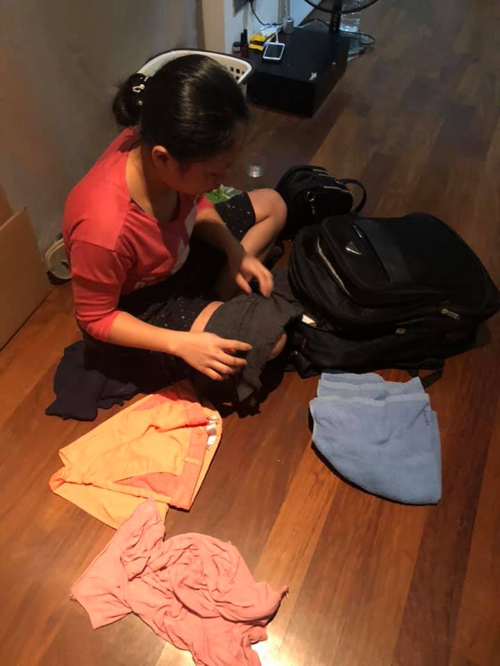 Indonesian maid folds her clothes. Photo: Mitch A Bern/Facebook