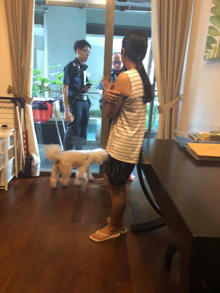 Two police officers take down statements. Photo: Mitch A Bern/Facebook