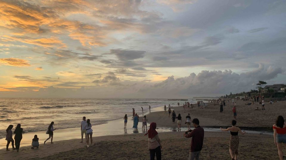 Photo taken in February 2020 of beachgoers at Batu Bolong Beach in Bali. Photo: Coconuts Media