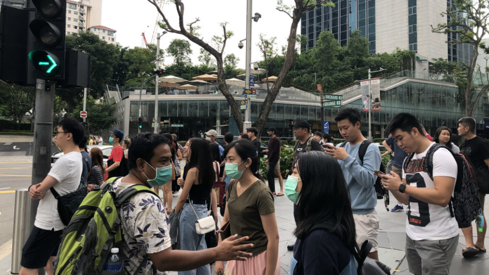 People wearing face masks in Singapore’s Orchard Road. Photo: Coconuts