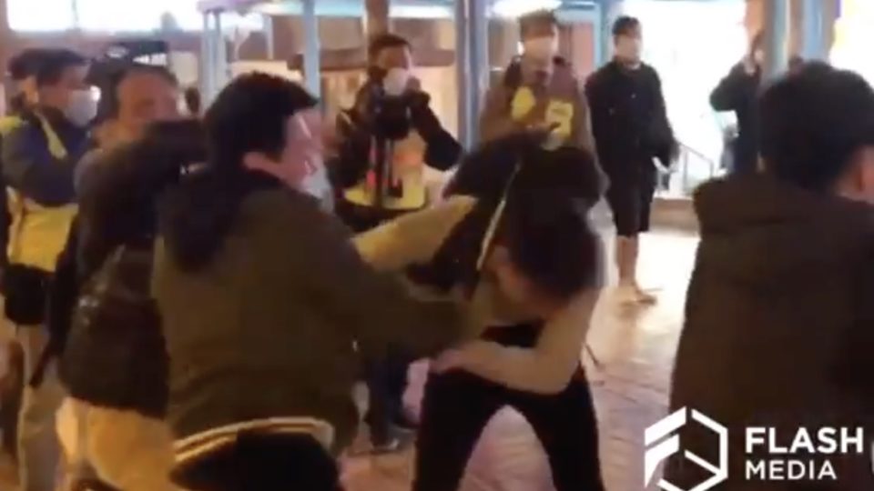 Plainclothes police officer hits a protester with a baton at a protest at a housing estate in Mei Foo. Screengrab via Facebook video/Flash Media.