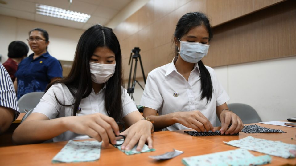 Women make masks in Thailand. Photo: Thai Department of Disease Control/Facebook