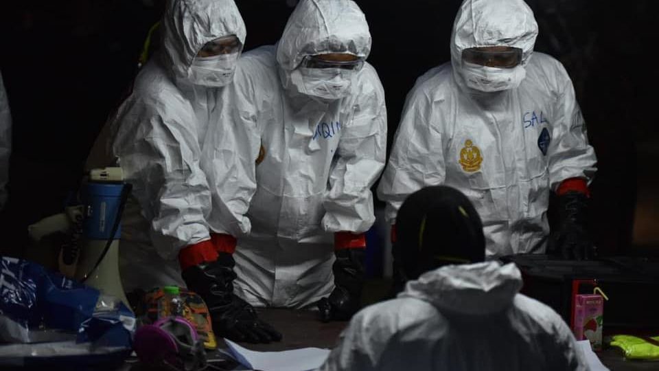 Malaysian medical workers confer in an undated photo. Photo: Noor Hisham Abdullah/Facebook