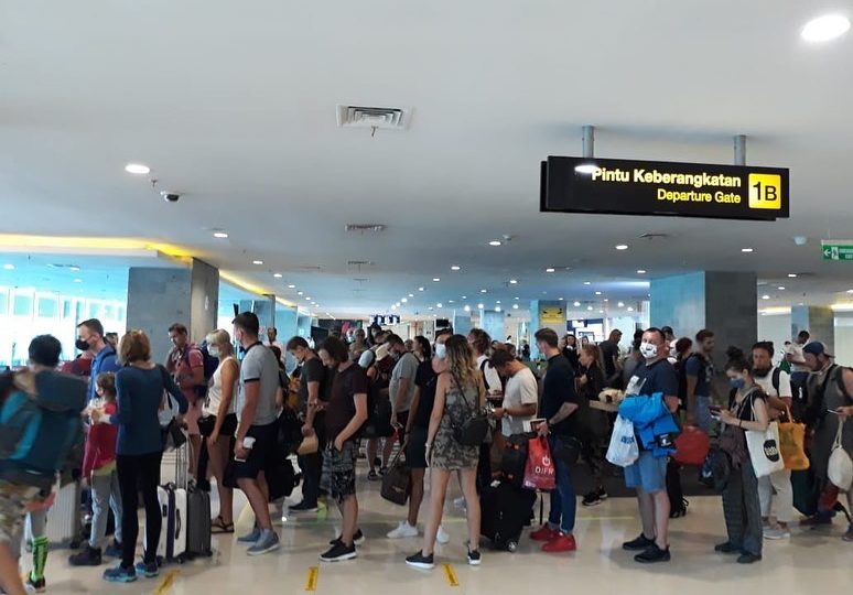 File photo of passengers lining up for departure at Ngurah Rai International Airport in March 2020. Photo: Ngurah Rai Immigration Office