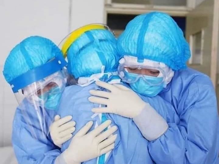 Malaysian medical workers embrace each other in a photo posted online today. Photo: Noor Hisham Abdullah/Facebook