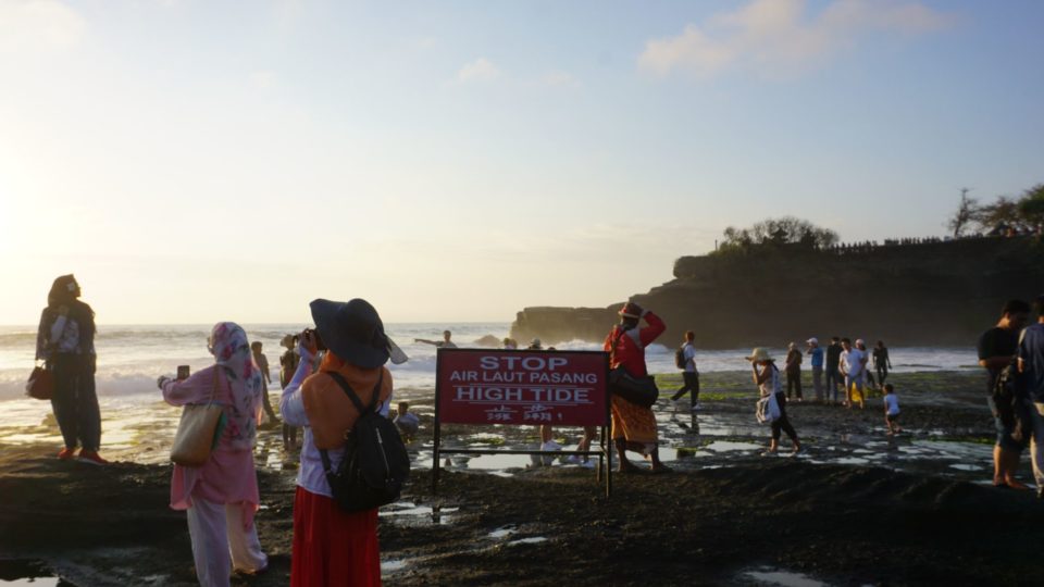 File photo of tourists at Tanah Lot. Photo: Coconuts Media