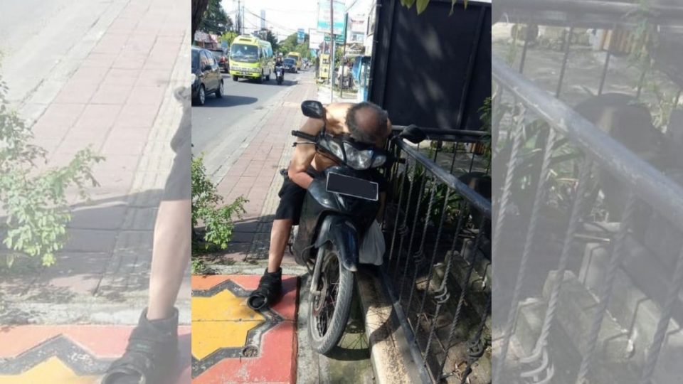 The foreigner appeared to experience seizures before fainting as he was sitting on his motorbike. Screengrab: Denpasar Viral / Instagram