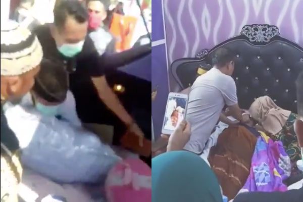 A deceased patient suspected of COVID-19 being brought home for a wake in Kolaka regency, Southeast Sulawesi. Photo: Video screengrab