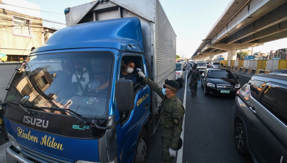 Vehicles pass through a special cargo lane at the North Luzon Expressway on March 19, days after the enhanced community quarantine was implemented. <i>Photo: Mark Demayo / ABS-CBN News</i>