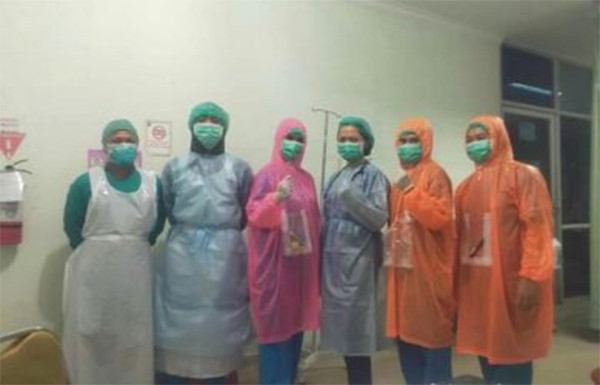 Viral Healthcare workers in Indonesia wear plastic raincoats for protection against COVID 19 Coconuts