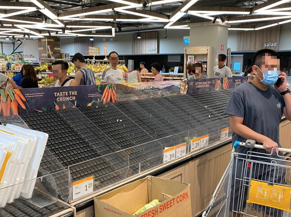 Shoppers wiping out items at a supermarket in Singapore. Edited photo: All Singapore Stuff/Twitter
