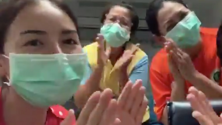 Thais clap to show their appreciation for the people risking everything to keep things going Sunday night in Thailand. @Snownitta/Twitter