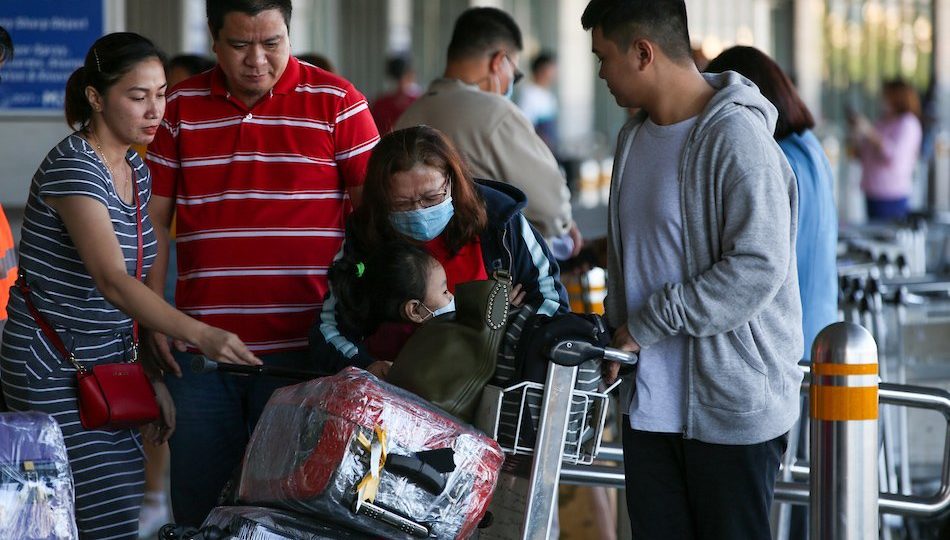 Filipino travelers at the Ninoy Aquino International Airport, taken Feb. 14 <i>Photo: Jonathan Cellona / ABS-CBN News</i>