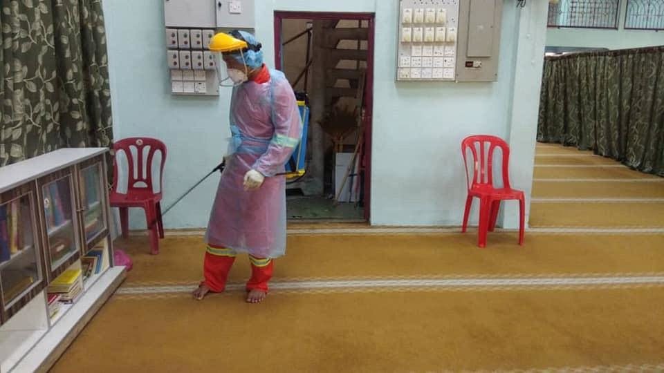 A worker disinfects a mosque in Malaysia in a photo dated March 30, 2020. Photo: Noor Hisham Abdullah/Facebook