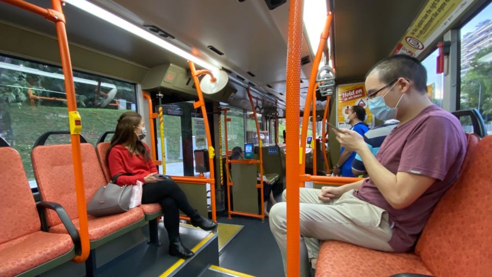 Commuters mask up on a bus in Singapore. Photo: Khaw Boon Wan/Facebook