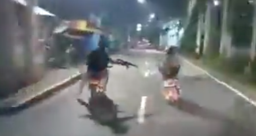 Cops and robbers in a high-speed motorcycle chase in East Jakarta. Photo: Video screengrab