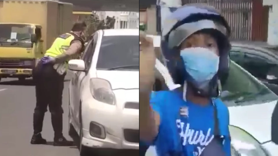 Rasoki Siregar, a police officer in the North Sumatra capital of Medan, is facing disciplinary sanctions for allegedly taking a bribe from a driver he stopped on the street and spitting on another. Screenshot from Facebook/Ling