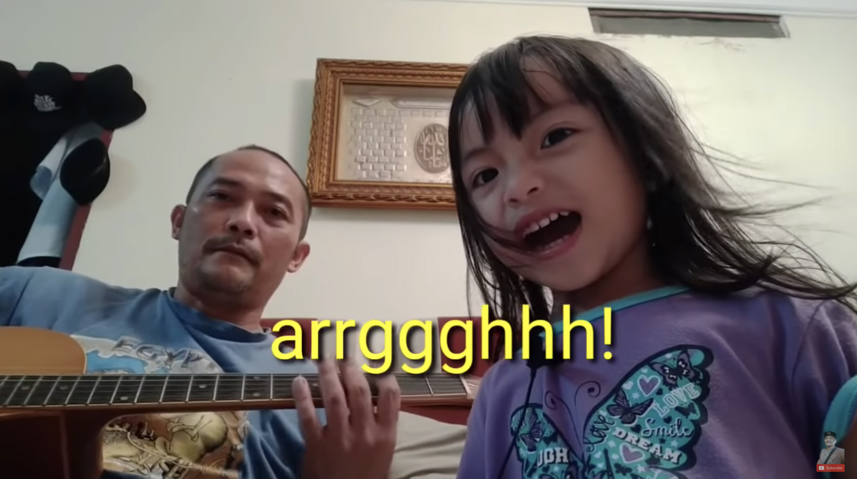 Musician Ujang Ijon and daughter Audrey cover ‘Killing In The Name’ by Rage Against The Machine. Photo: Paradigmaestro/YouTube